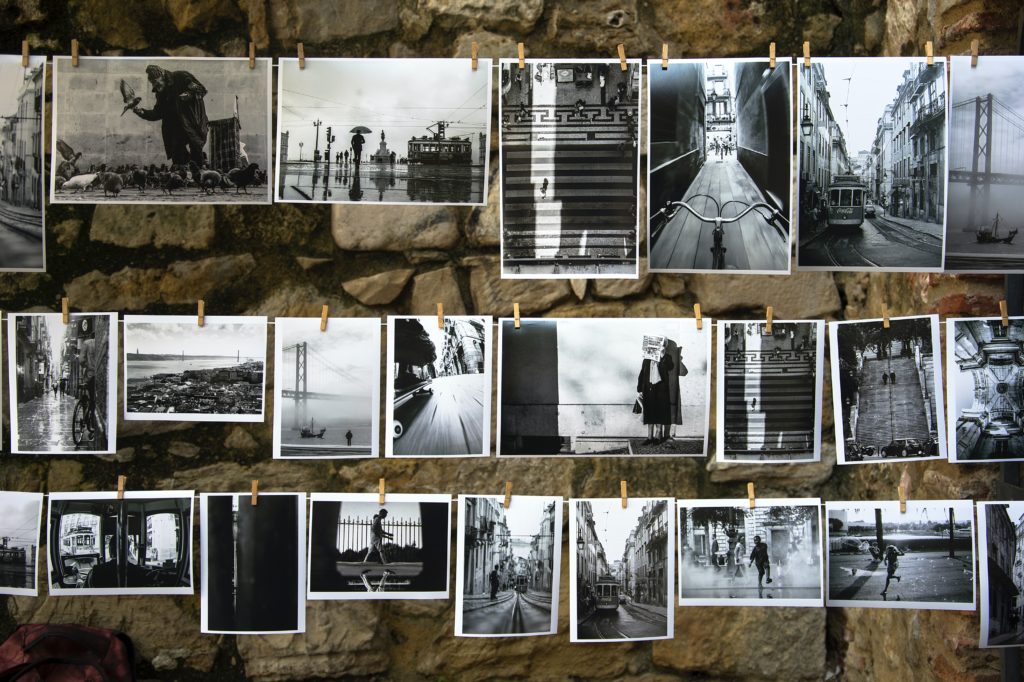 black and white photos hanging with close pins