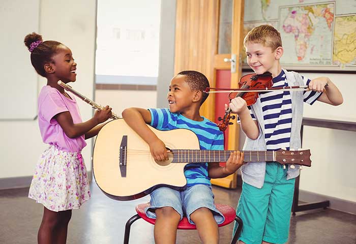 arts for critical thinking 3 diverse children playing musical instruments